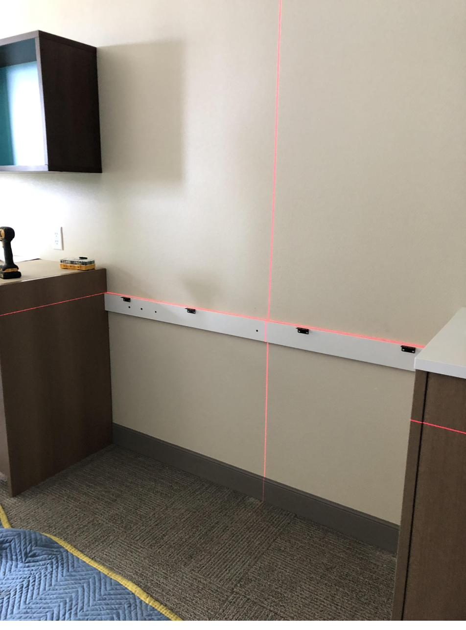 Laser-leveled alignment during install — precision setup before final placement