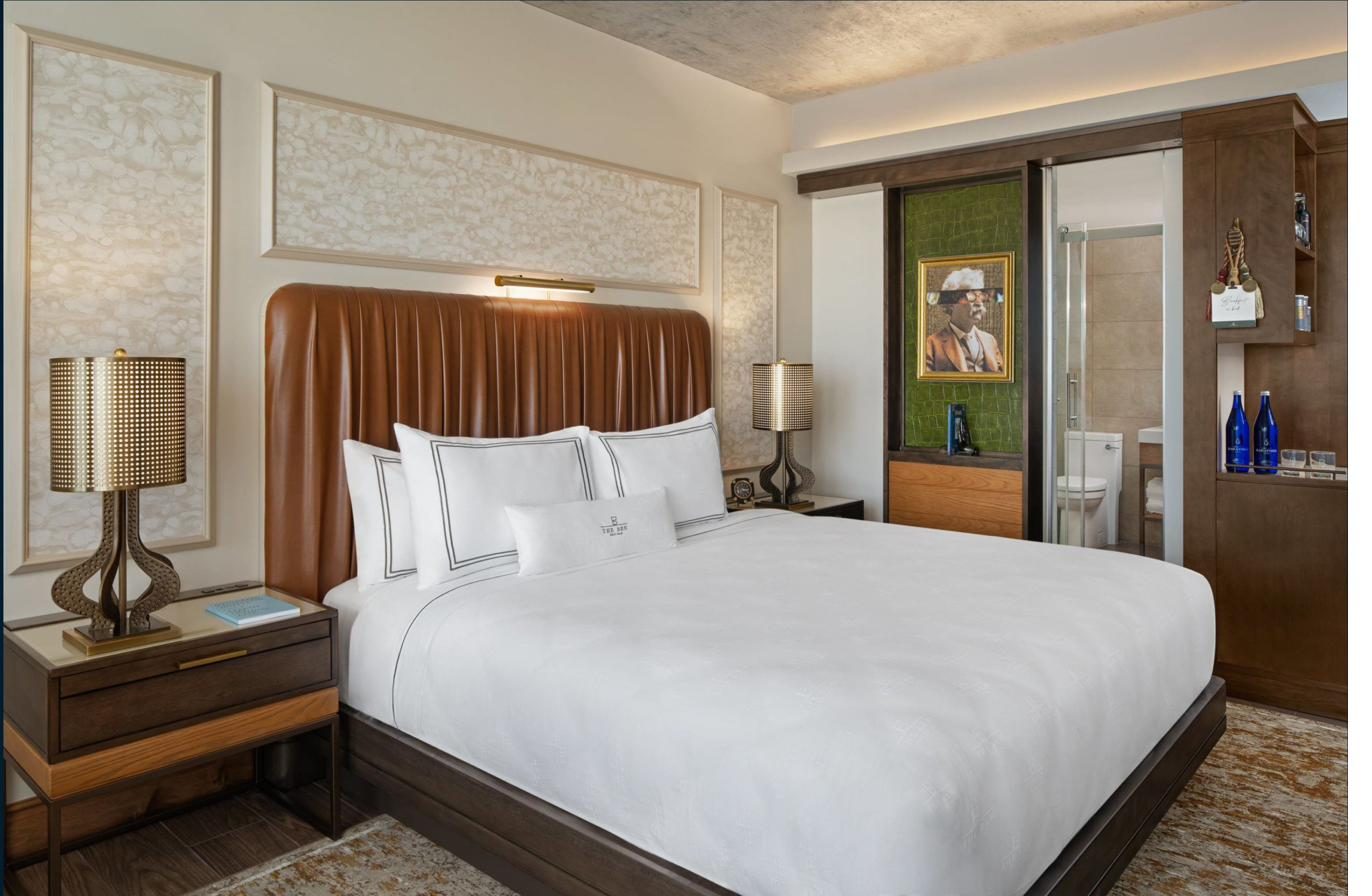 Luxury hotel suite fully outfitted with OS&E — lamps, art, bedding, accessories