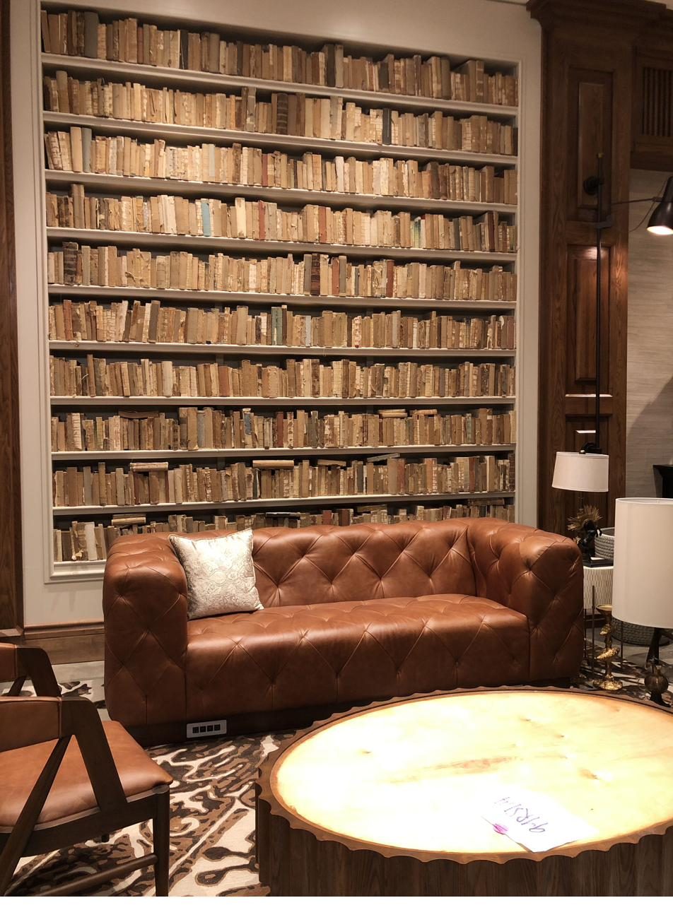 Custom millwork bookcase wall installation in hotel lobby